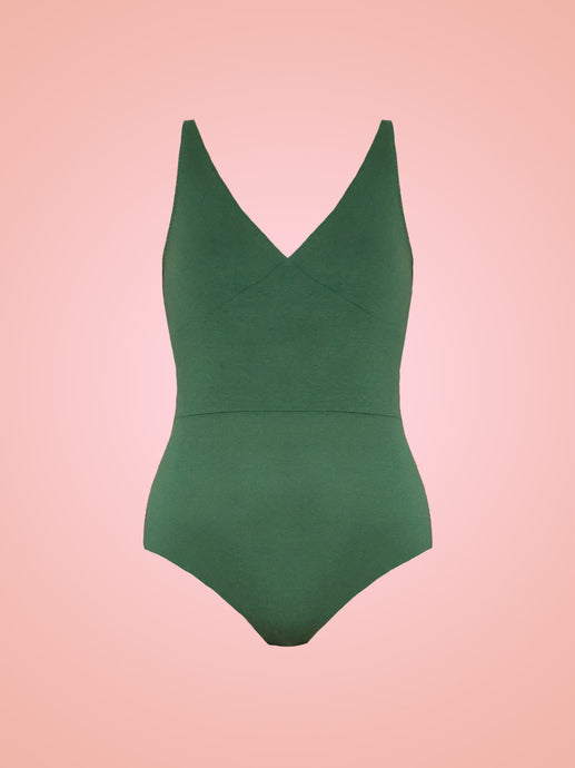 Green Tencel Cleo bodysuit with V neck cups and high waist band in front of pink ombre background