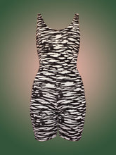 Load image into Gallery viewer, Deadstock black and white zebra print unitard in front of green and pink ombre background 
